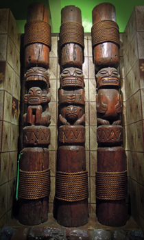 One of two sets of three cannibal tikis in the vestibule